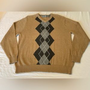 Oscar De La Renta SZ -L is a men's V-neck sweater. Color - Tan.